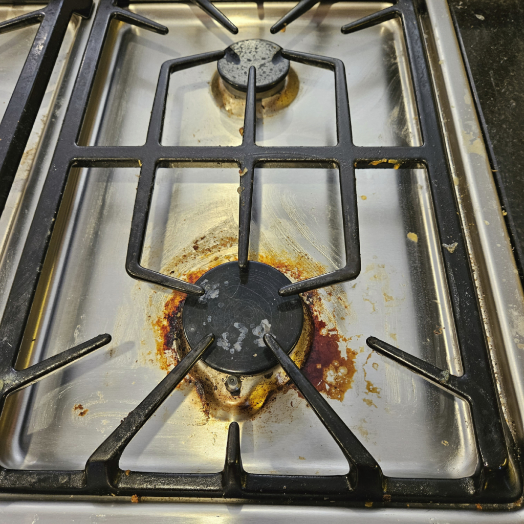 dirty kitchen stove burners before cleaning Omaha NE grease buildup stove cleaning service Omaha Nebraska
